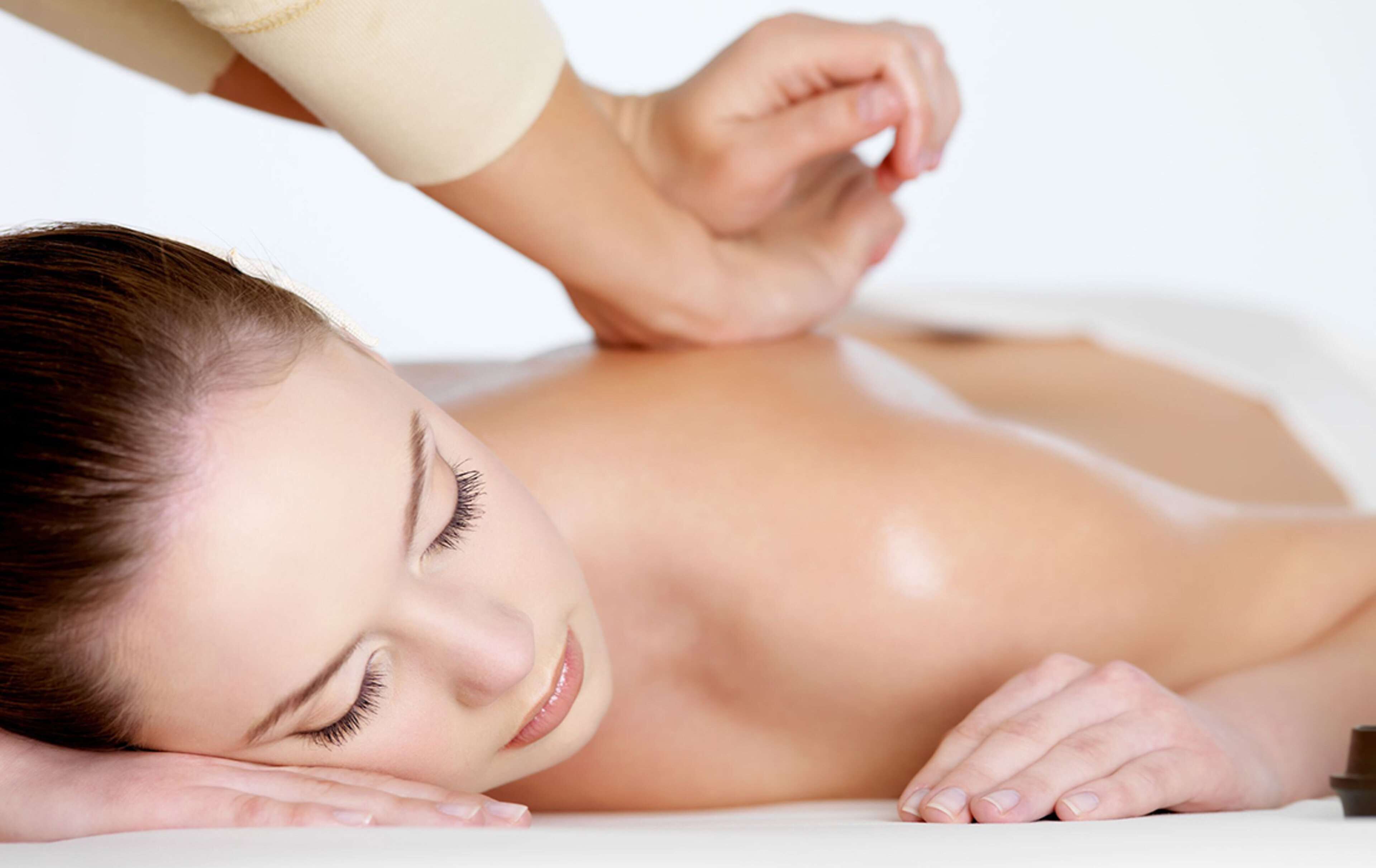 A person receiving a back massage.