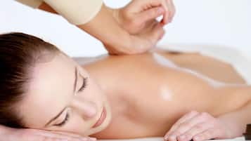 A person receiving a back massage.