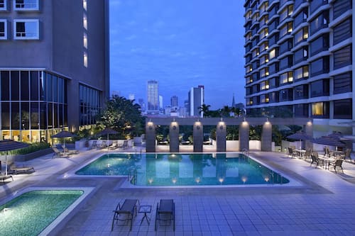 Outdoor pool, open 7 AM to 8:00 PM, pool umbrellas, pool loungers