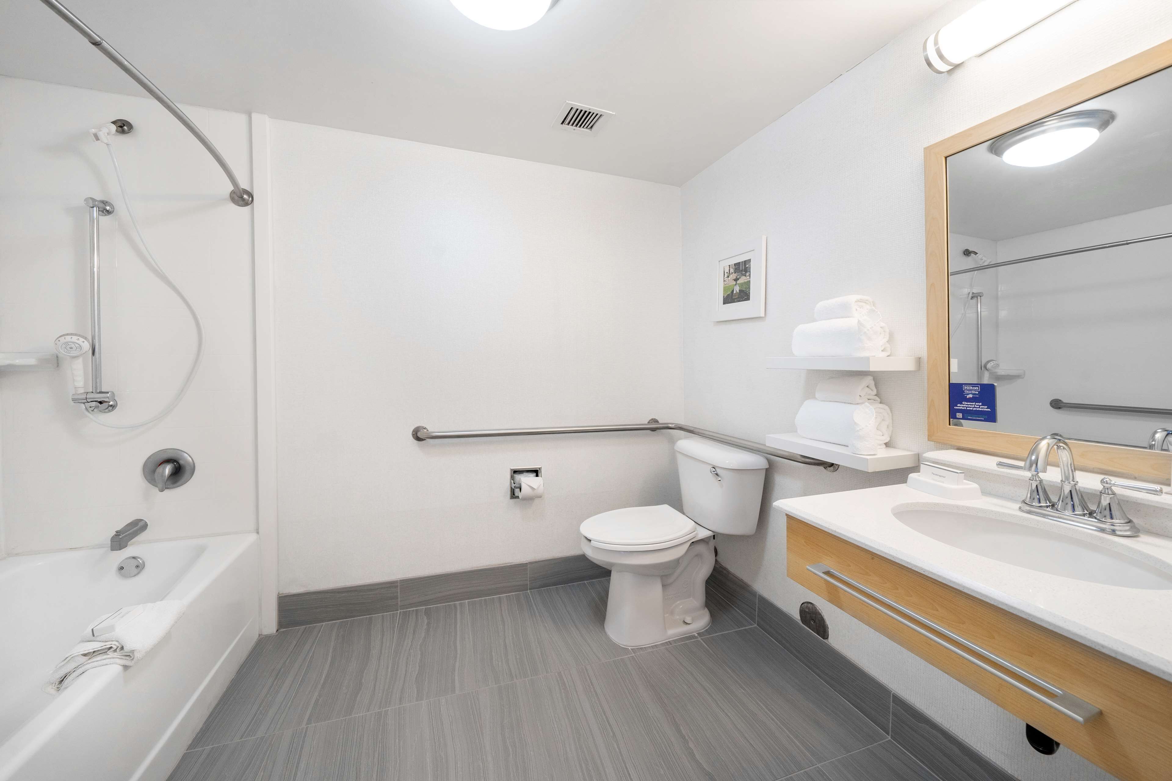 designer toiletries, hair dryer, towels