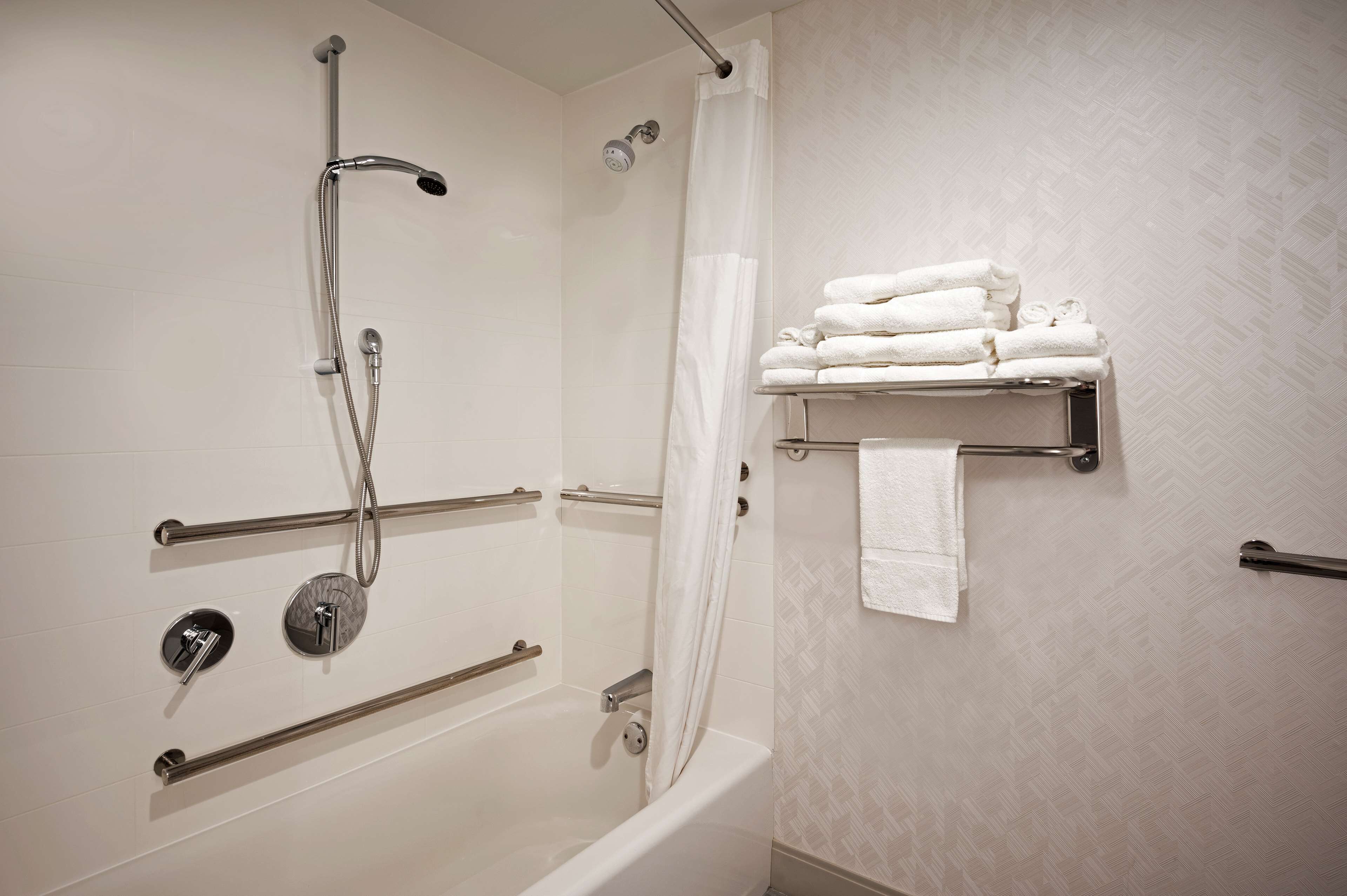 designer toiletries, hair dryer, towels, soap