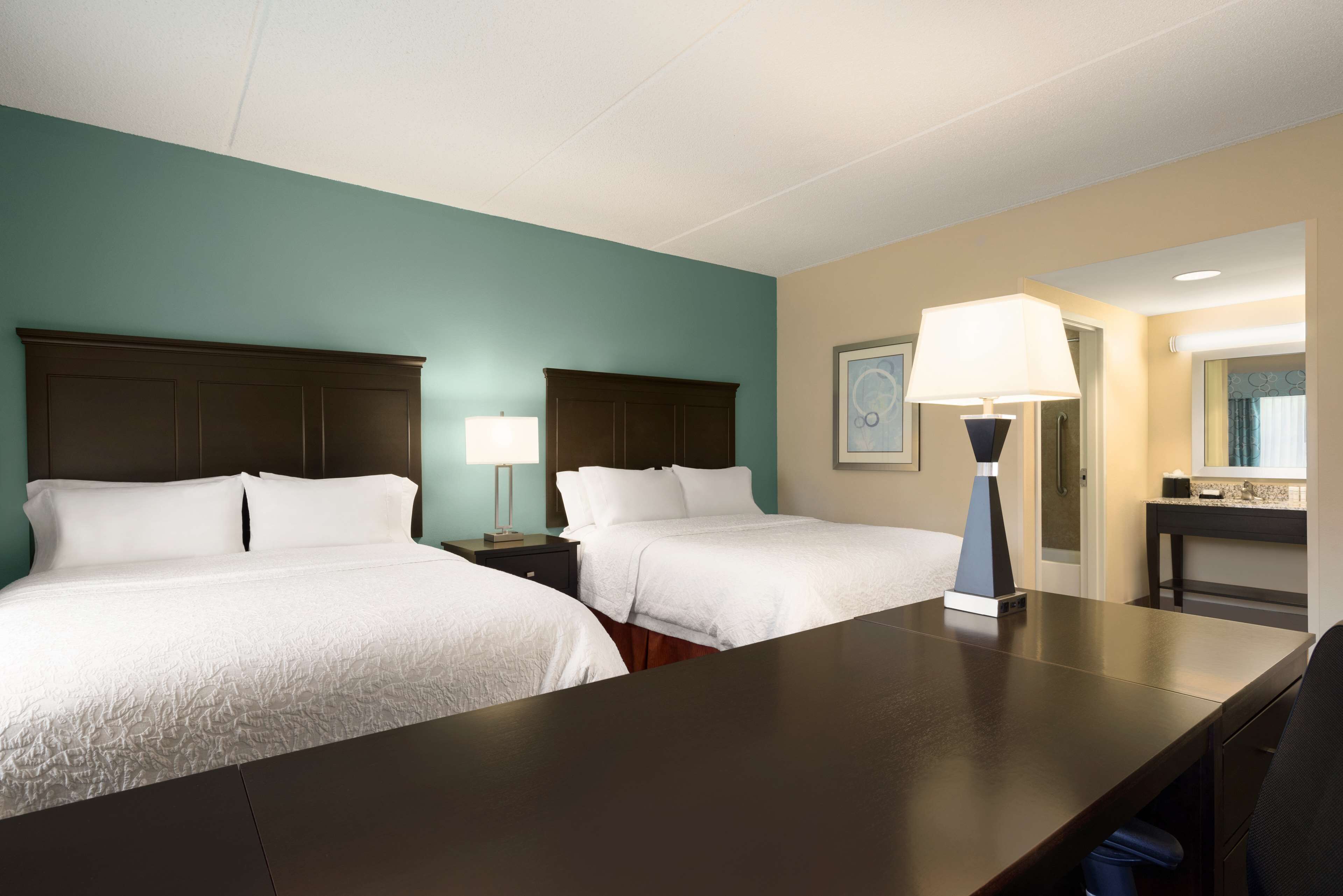 suite, 2 queen beds, non smoking | in-room safe, desk, iron/ironing board, free cots/infant beds