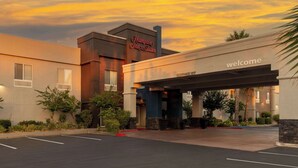 A modern hotel entrance with a clear sign reading "Hampton Inn & Suites" and a "Welcome" sign above the entrance. - Hampton Inn & Suites Sacramento-Cal Expo (Sacramento)