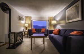 Three Bedroom Condo located at Mountainside Resort (no pets) | Living room | 32-inch flat-screen TV with cable channels, TV - Sun & Ski Inn And Suites (Stowe)