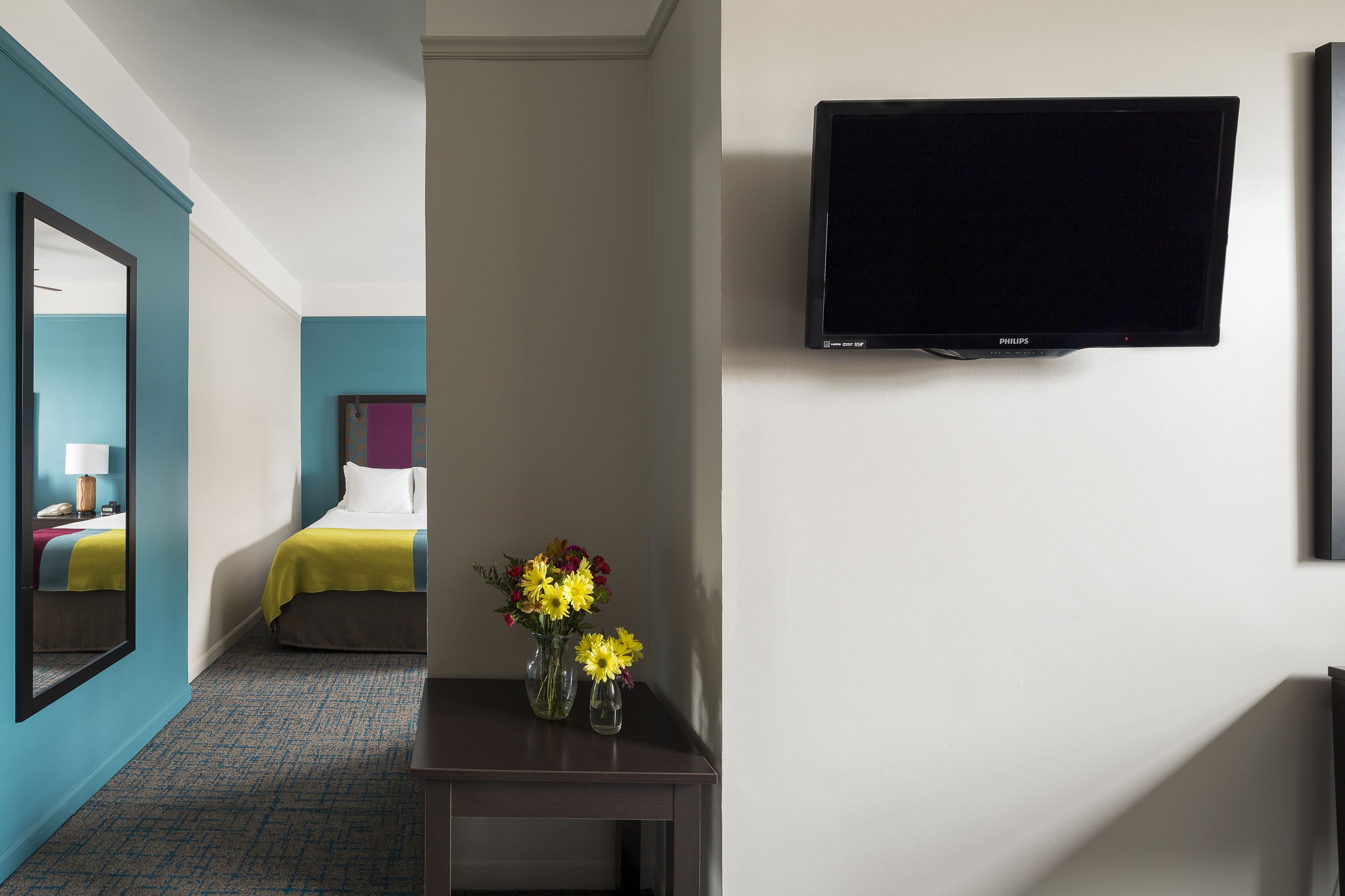 deluxe double room, 2 double beds | living area | flat-screen tv, video game console, pay films