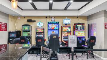 Experience the excitement of gaming at our lounge, featuring a range of machines and comfortable seating for a fun night in.