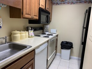 Condo (102) | Private kitchen | Fridge, microwave, oven, stovetop
