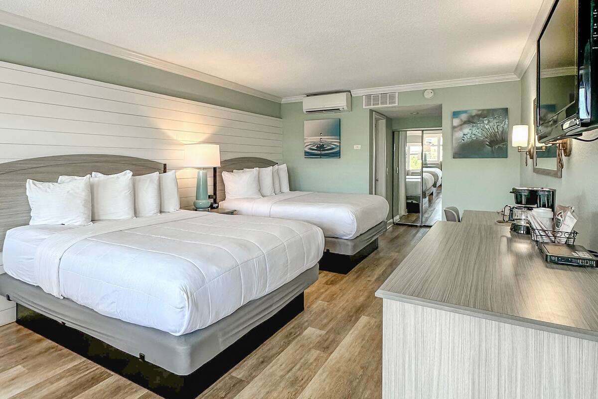 room, 2 queen beds, refrigerator & microwave | 1 bedroom, in-room safe, desk, blackout curtains