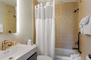 Suite, 1 King Bed with Sofa bed, Non Smoking | Bathroom | Combined shower/tub, free toiletries, hair dryer, towels