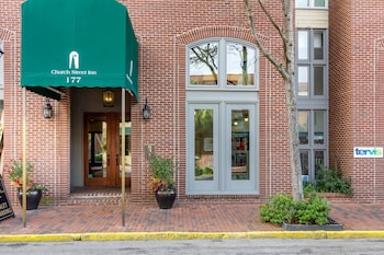 Hotel amenities such as safe, desk and work area at Church Street Inn Historic Charleston, Ascend Collection Hotel