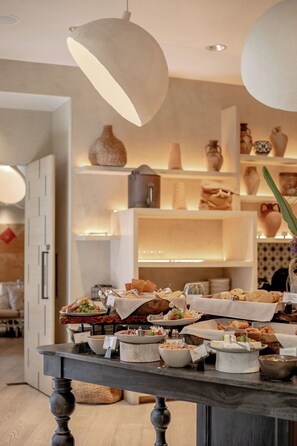 Daily buffet breakfast (USD 36 per person)