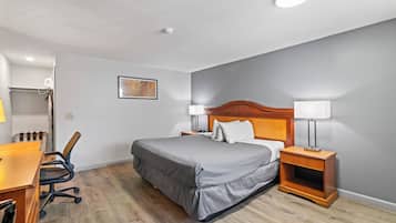 Basic Room, 1 Queen Bed, Smoking | Bathroom | Combined shower/tub, free toiletries, hair dryer, towels