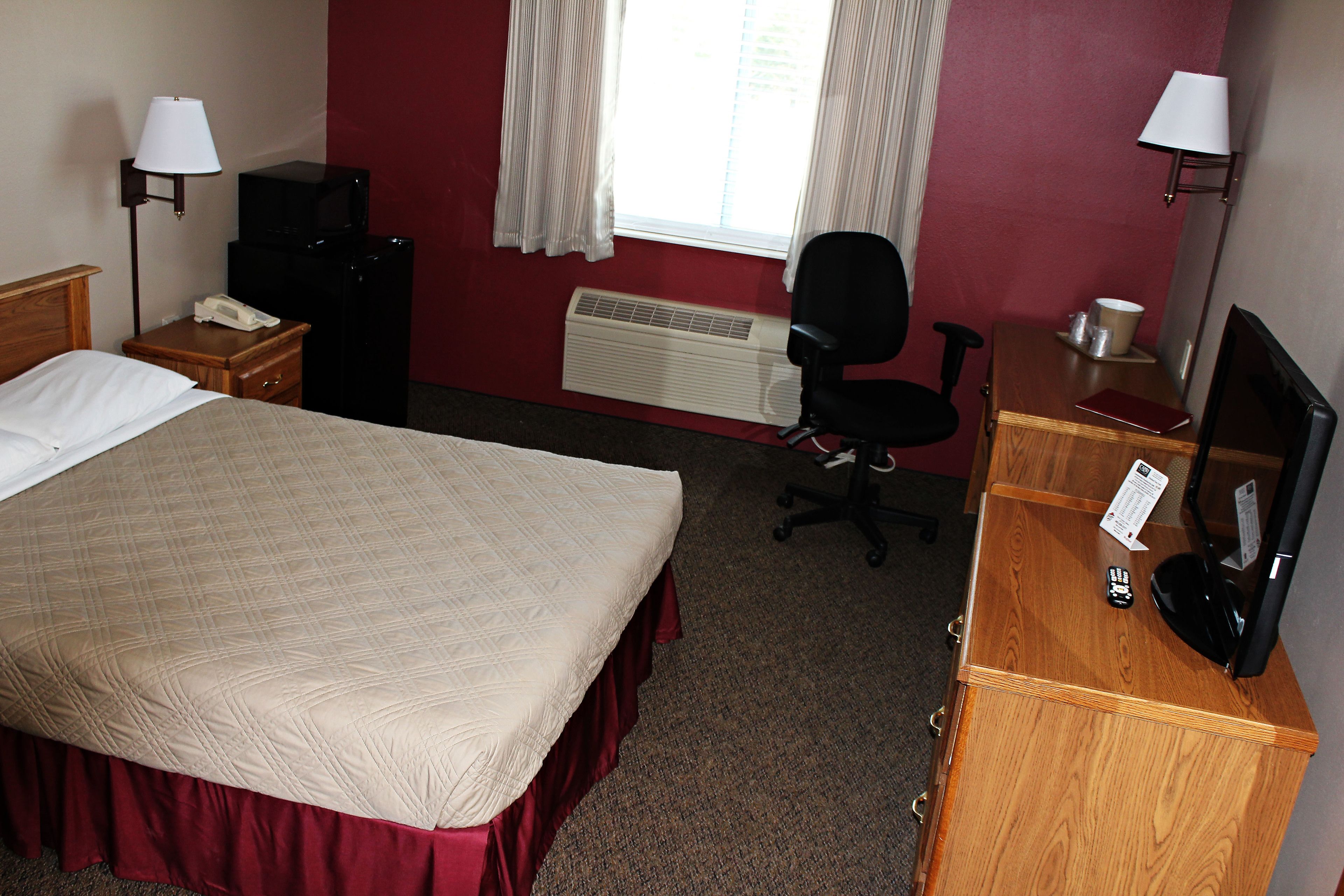 pillow-top beds, desk, blackout curtains, iron/ironing board