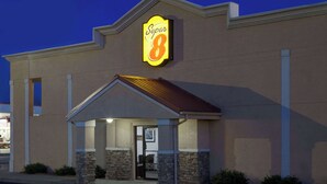 A Super 8 hotel with a prominent sign, a covered entrance, and stone pillars. - Super 8 by Wyndham Lafayette / Purdue Area (Lafayette)