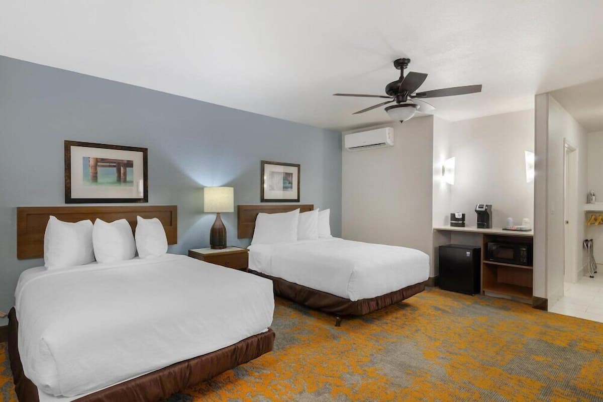 Premium bedding, pillow-top beds, desk, laptop workspace