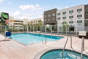 Outdoor pool, a heated pool, open 8 AM to 10 PM, pool loungers