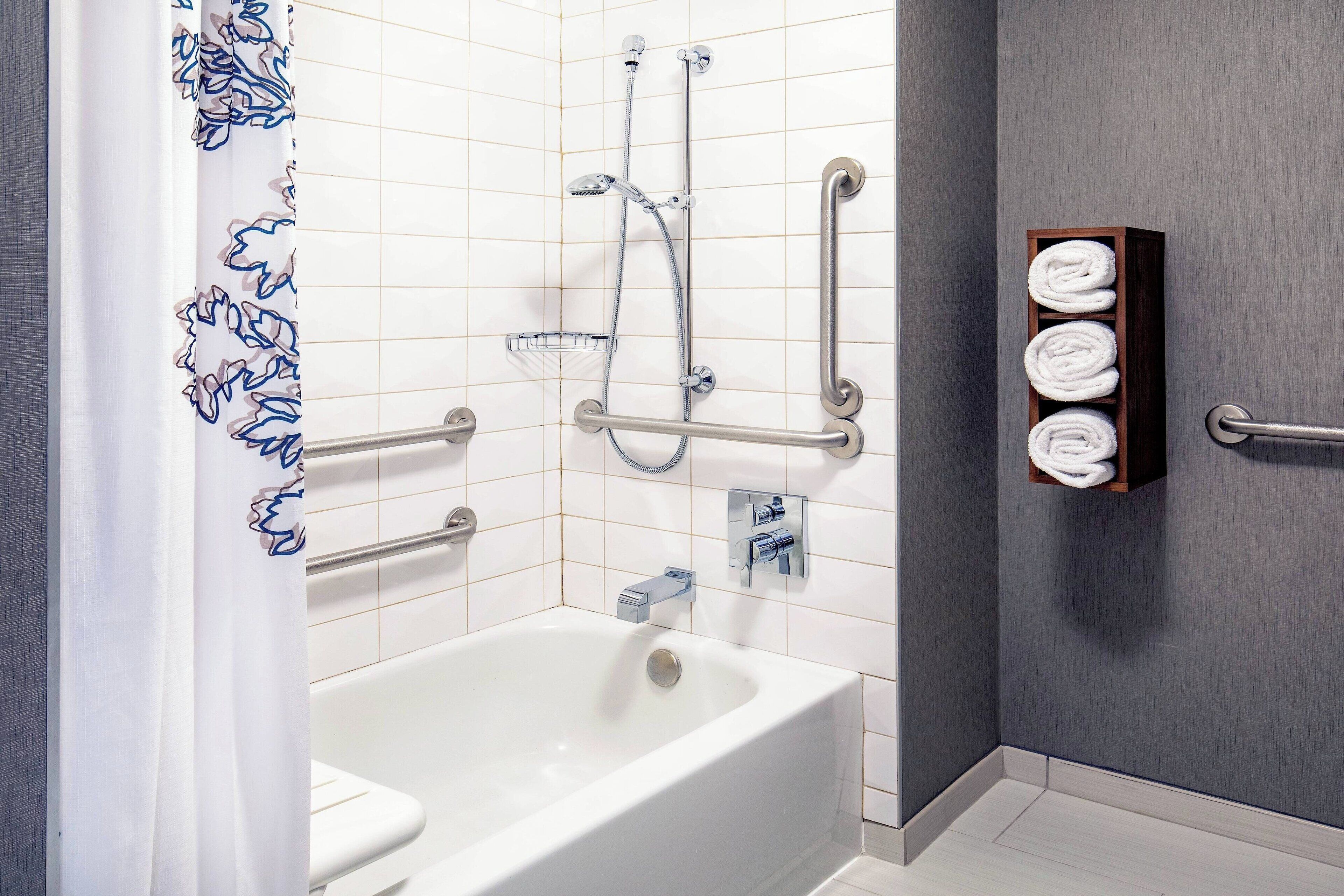 bathtub, free toiletries, hair dryer, towels