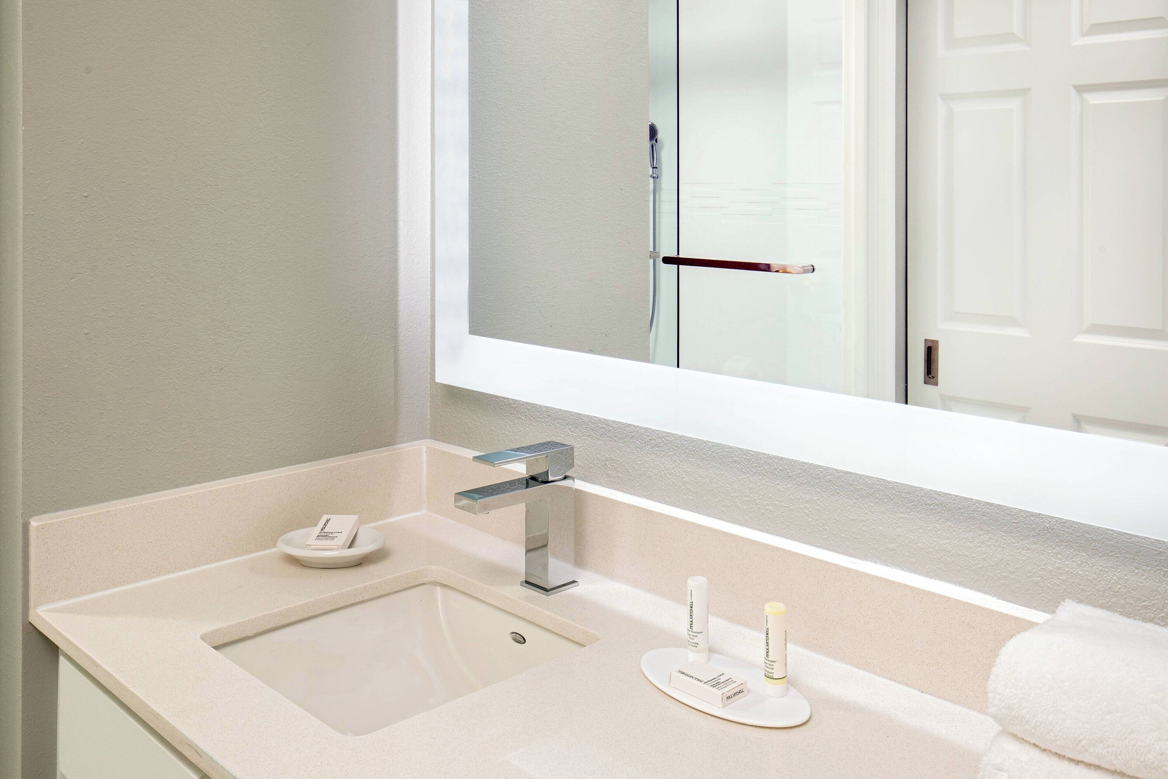 bathtub, free toiletries, hair dryer, towels