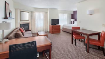 Premium bedding, desk, laptop workspace, blackout drapes