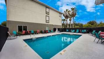 Seasonal outdoor pool, open 8:00 AM to 10:00 PM, pool umbrellas