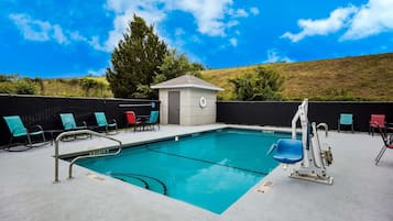 Seasonal outdoor pool, open 8:00 AM to 10:00 PM, pool umbrellas