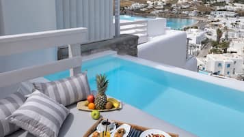 Seasonal outdoor pool, open 11 AM to 7:00 PM, sun loungers