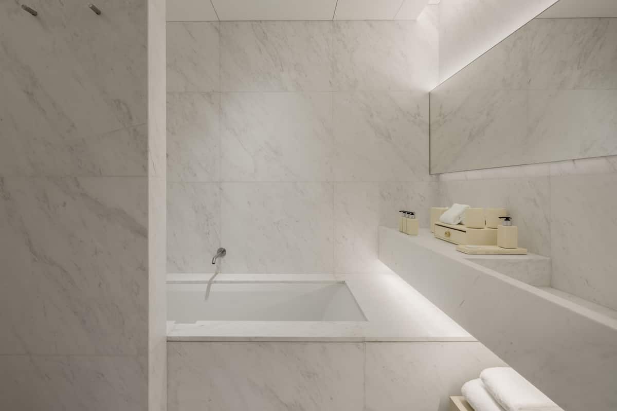 designer toiletries, hair dryer, bathrobes, towels