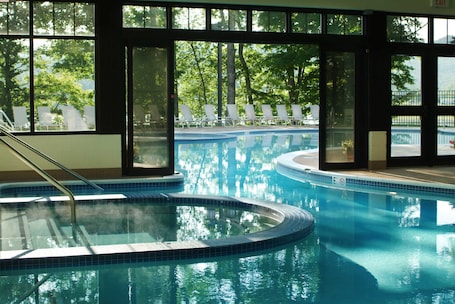Indoor pool, outdoor pool, pool umbrellas, pool loungers. Stonewall Resort