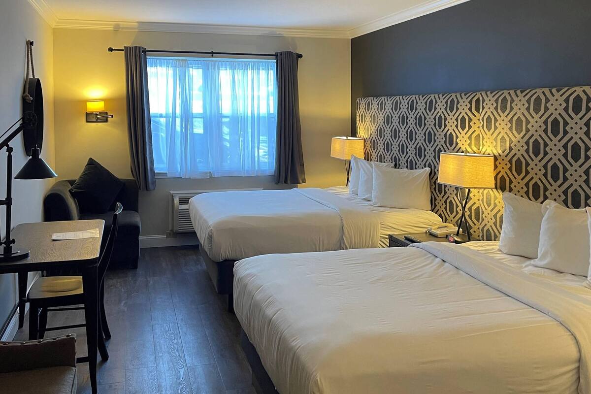 Premium bedding, pillowtop beds, desk, laptop workspace