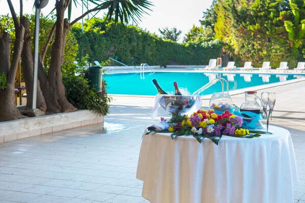 Seasonal outdoor pool, pool umbrellas, pool loungers