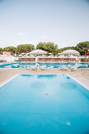 Seasonal outdoor pool, pool umbrellas, pool loungers