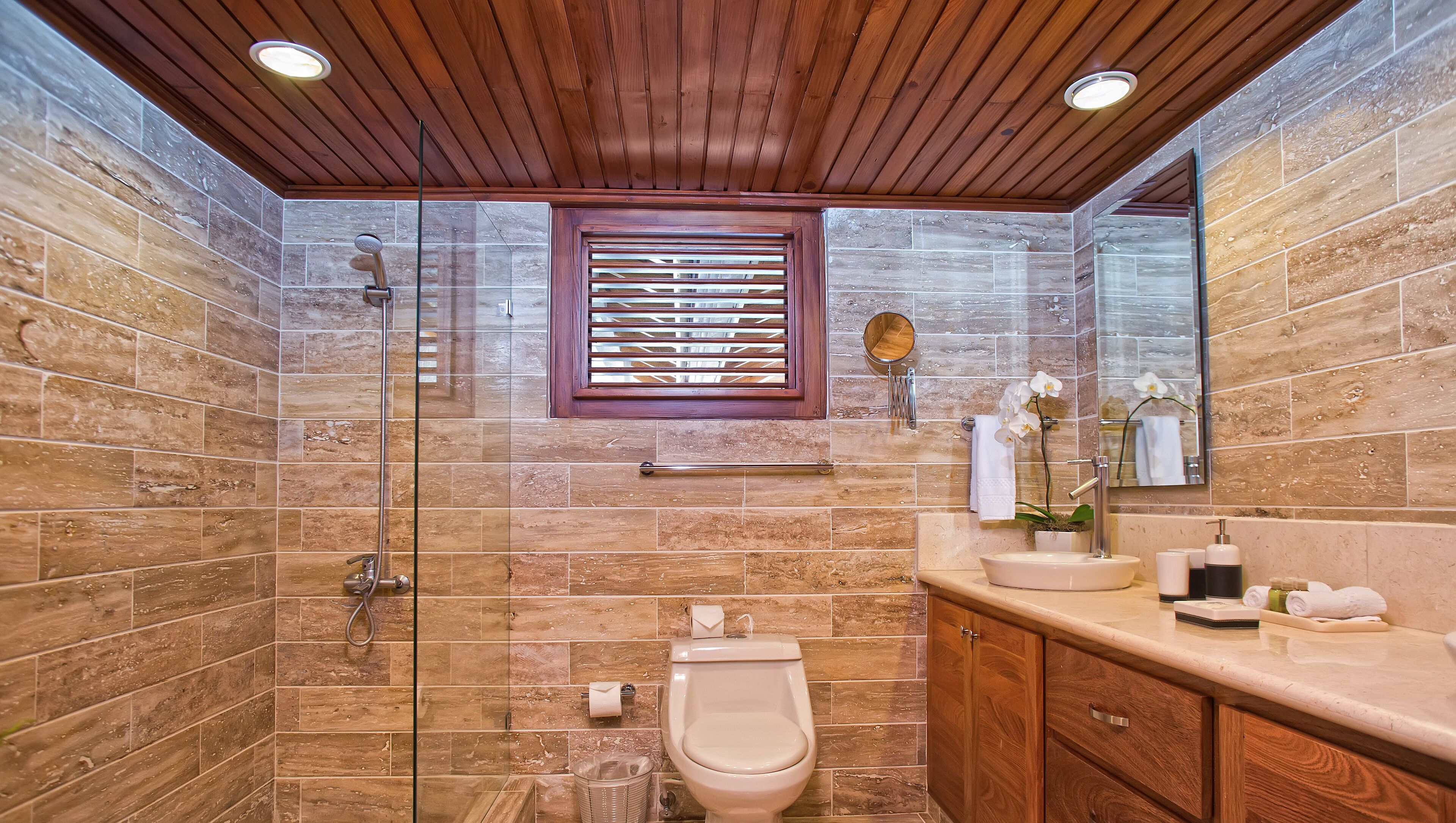 deep-soaking bathtub, designer toiletries, hair dryer, bathrobes