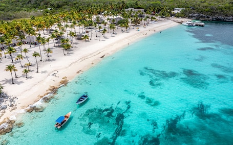 Private beach, white sand, free beach shuttle, free beach cabanas