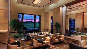 A spacious lobby with a seating area, large windows, and a staircase. - The Westin Kierland Resort and Spa (Scottsdale)