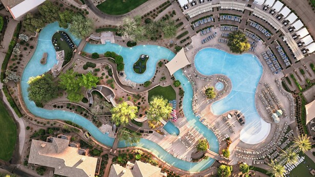 An aerial view of a resort with multiple swimming pools, landscaped areas, and a variety of seating arrangements. - The Westin Kierland Resort and Spa (Scottsdale)