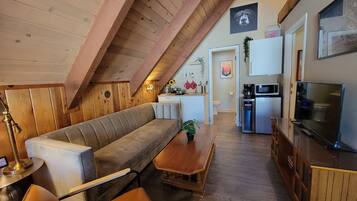 Great for Families - Studio Suite | Living area | Flat-screen TV, fireplace