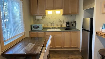 Luxury Suite, 1 Bedroom | Private kitchen | Full-size fridge, microwave