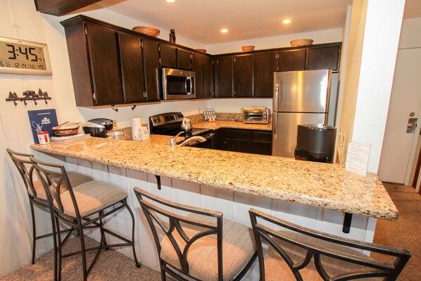 2-Bedroom Condo | Private kitchen | Full-sized fridge, microwave, stovetop, dishwasher