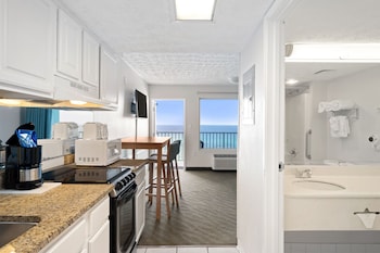 Suite (Ocean/Gulf View) | Private kitchen | Full-size fridge, microwave, oven, stovetop at Beachcomber Beachfront Hotel, a By The Sea Resort