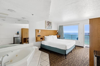 Suite, Jetted Tub (Ocean/Gulf View) | 1 bedroom, iron/ironing board, free WiFi, bed sheets at Beachcomber Beachfront Hotel, a By The Sea Resort