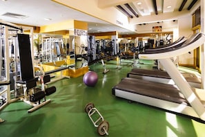 A gym with treadmills, weight machines, and exercise balls. - Baisan International Hotel (Manama)