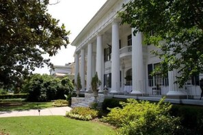A classical building with a symmetrical facade, large columns, and a central entrance.