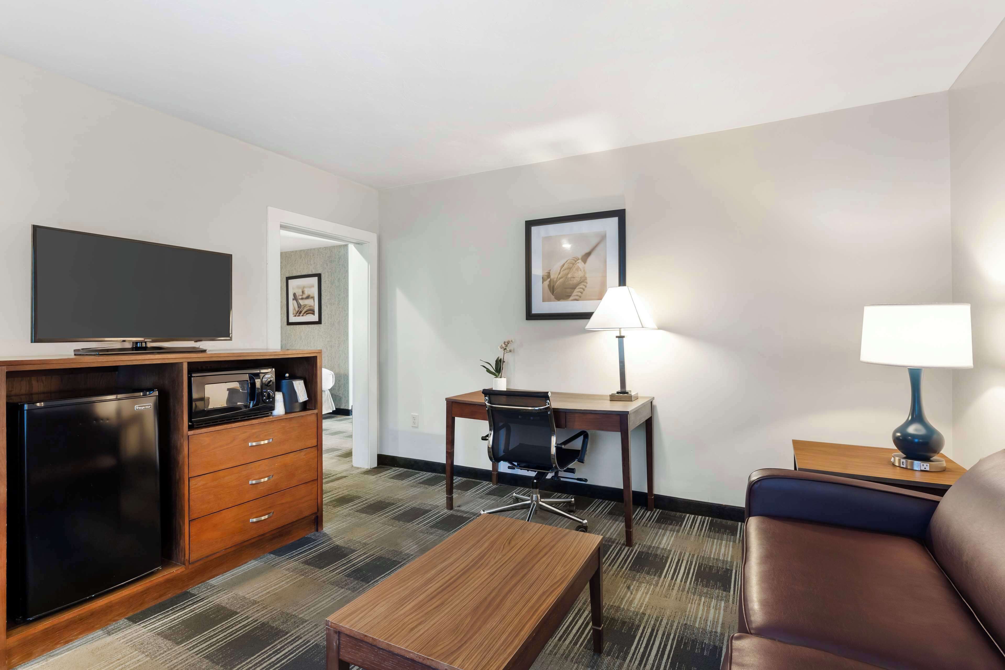 suite, 2 queen beds, non smoking (larger room;with sofabed) | 1 bedroom, in-room safe, desk, laptop workspace