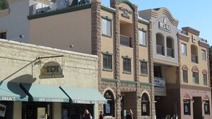 A building with a sign for 'Green Front Theater' and 'Mineral Palace' on the facade. - Mineral Palace Hotel & Casino (Deadwood)