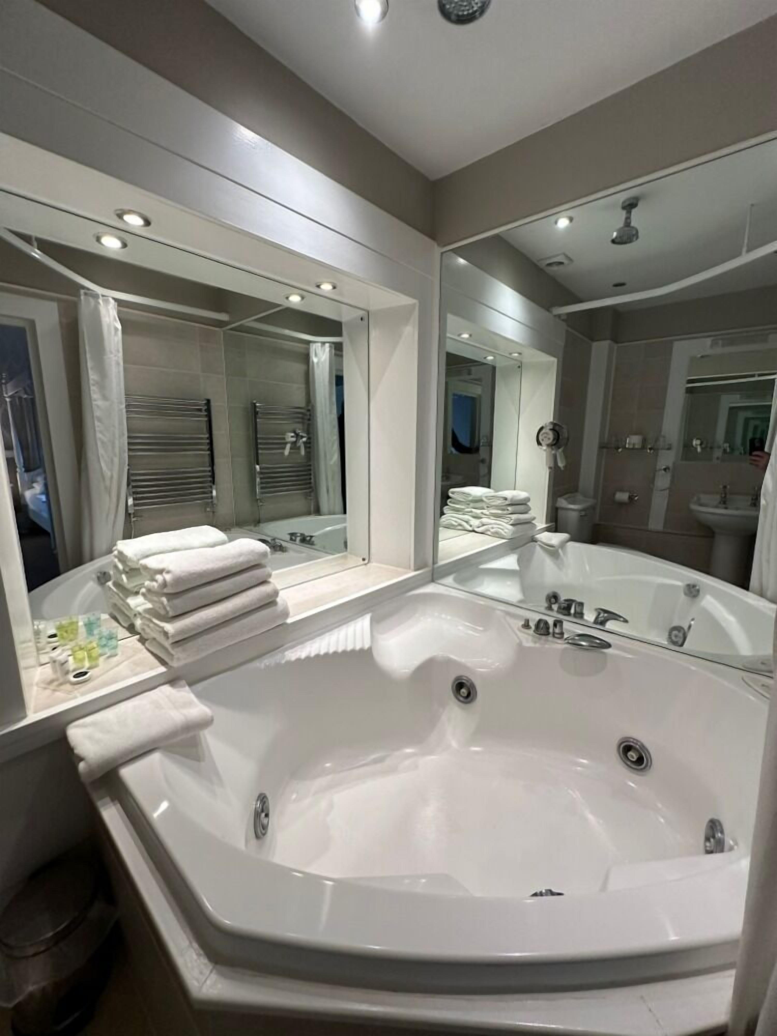 executive suite, ensuite, garden view | bathroom | designer toiletries, hair dryer, towels