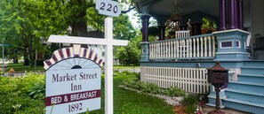 A sign for Market Street Inn with a date of 1892, indicating a historical establishment.
