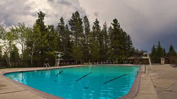 Seasonal outdoor pool, open 10:00 AM to 8:00 PM, pool loungers