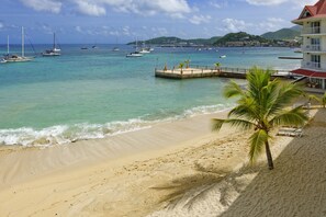 On the beach, white sand, free beach cabanas, sun loungers