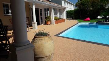 Seasonal outdoor pool, open 9 AM to 9 PM, pool loungers