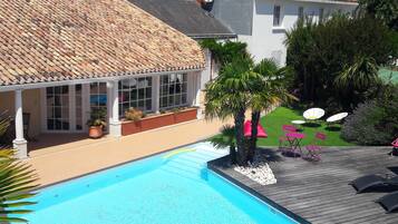 Seasonal outdoor pool, open 9 AM to 9 PM, pool loungers